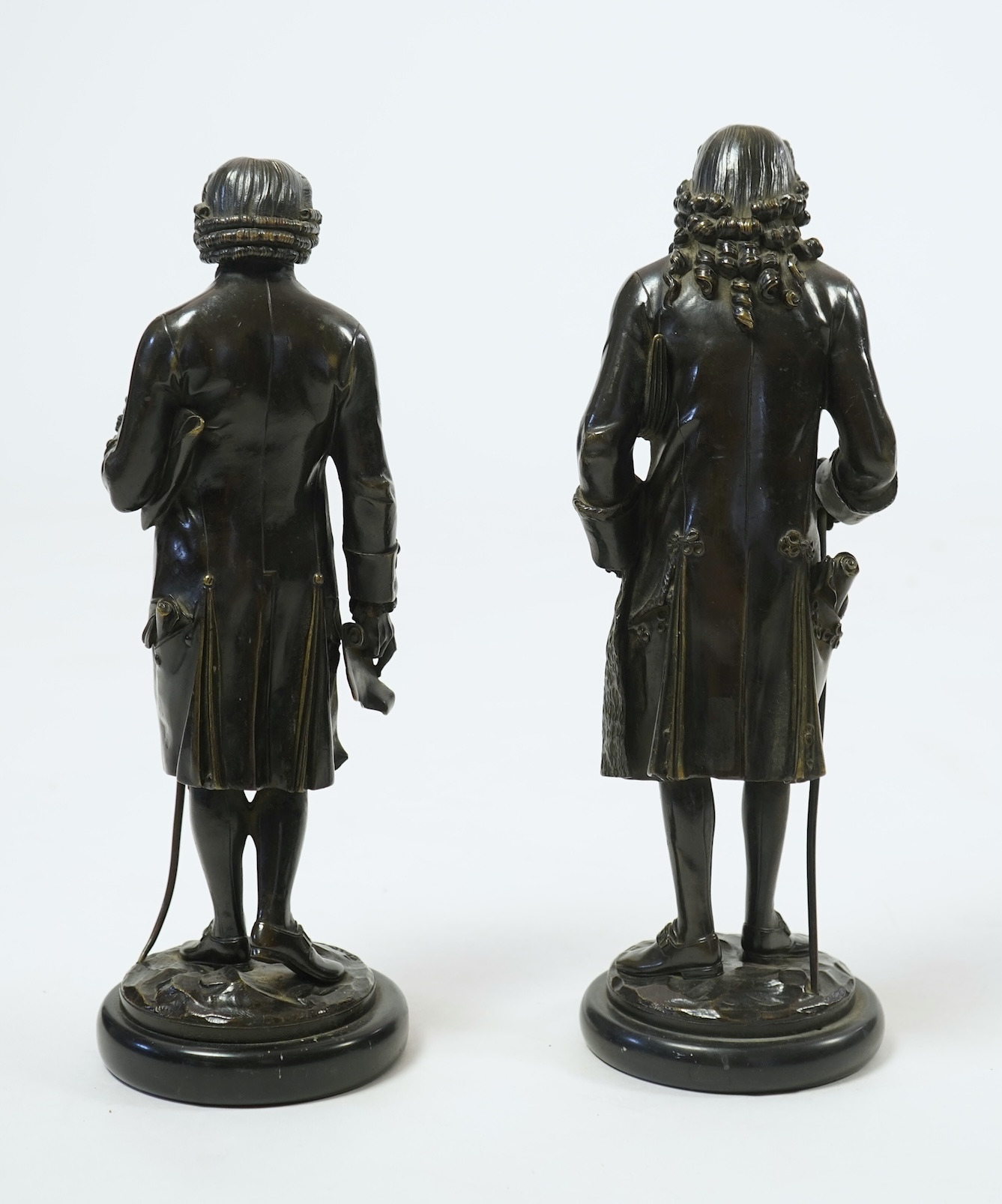 After Jean-Claude-Joseph Rosset (1706-1786), two patinated bronze figures of Voltaire and Jean-Jacques Rousseau, 19th century